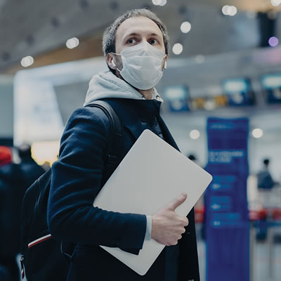 Man in mask at airport